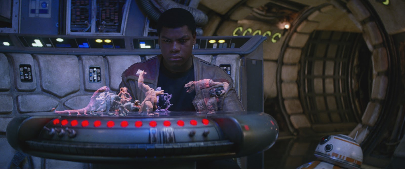 John Boyega in Star Wars looking at a holographic chess game